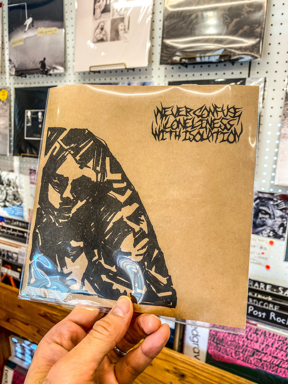 Never Confuse Loneliness With Isolation - "行き場のない悪臭 / 不整脈" (7inch)